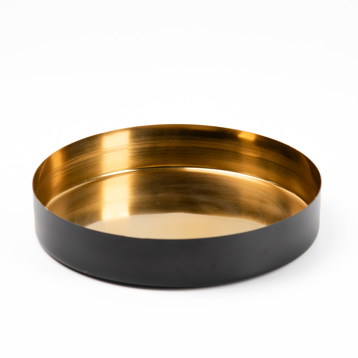 A round metal tray with a brushed gold interior and a matte black exterior, photographed on a clean white background.