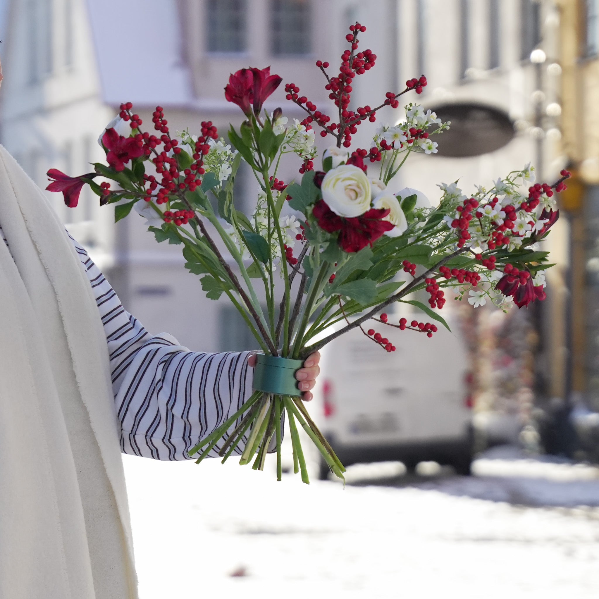 Hanataba bouquet with Red alstroemeria, white ranunculus, red hypericum berries and mixed greenery in a Hanataba bouquet twister Ivy Green