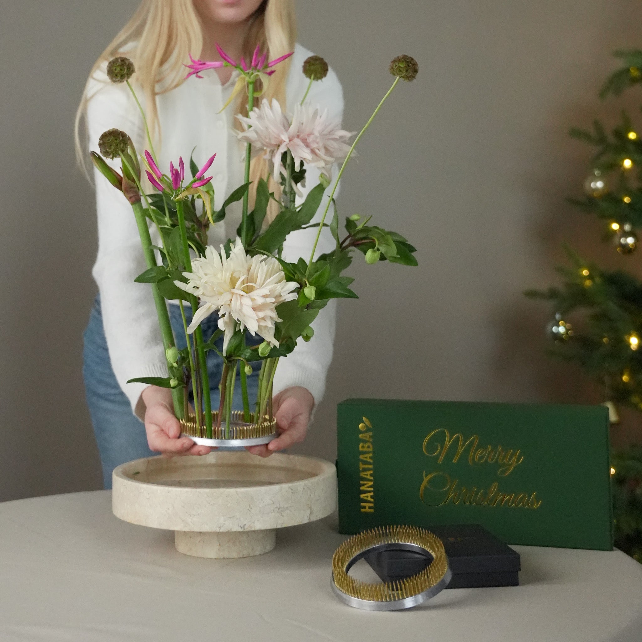 Artistic floral arrangement created with Hanataba Kenzan 120 mm placed in a marble bowl, combining modern Scandinavian design with traditional ikebana technique.