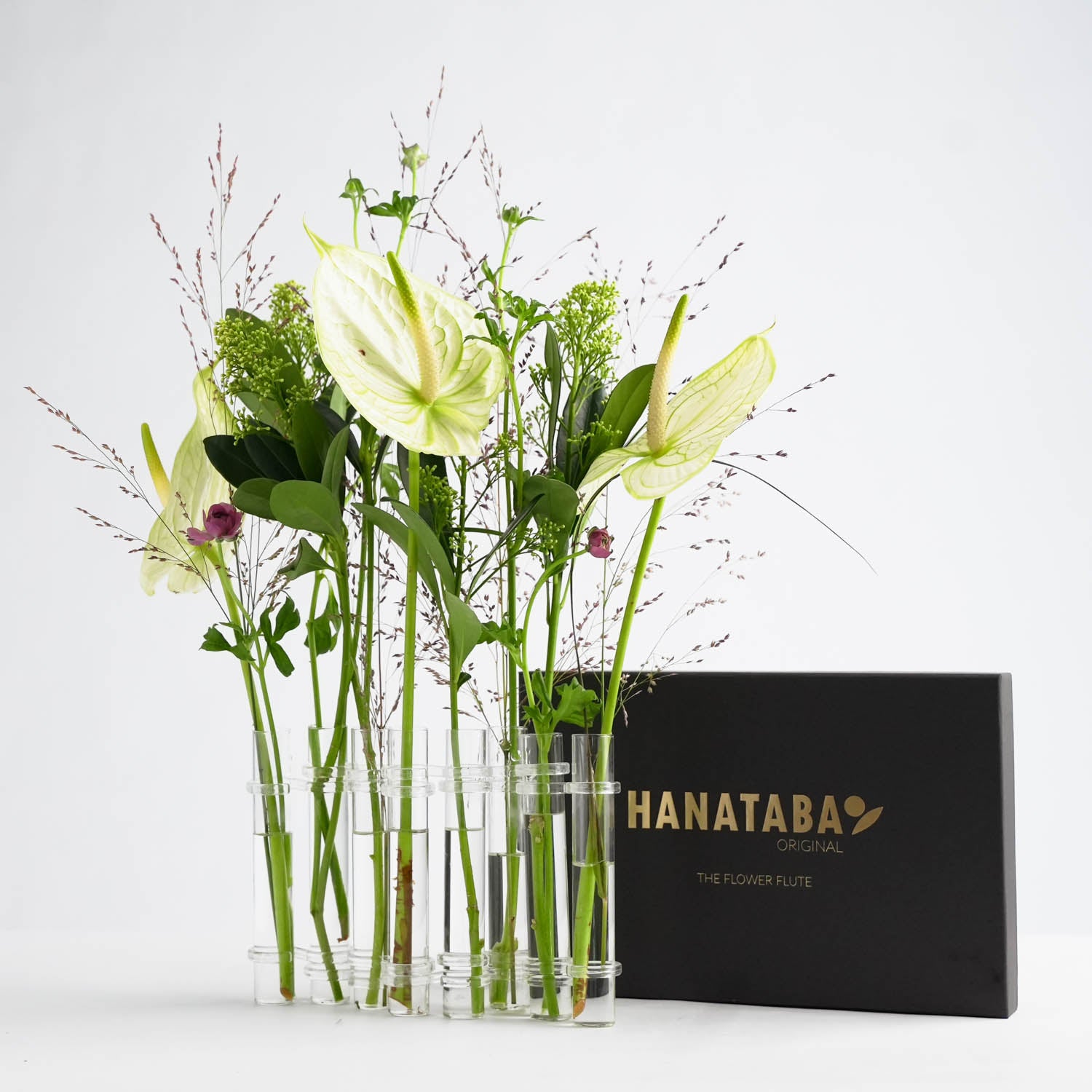 hanataba glass vases linked together creating a chain of minimalist glass vases