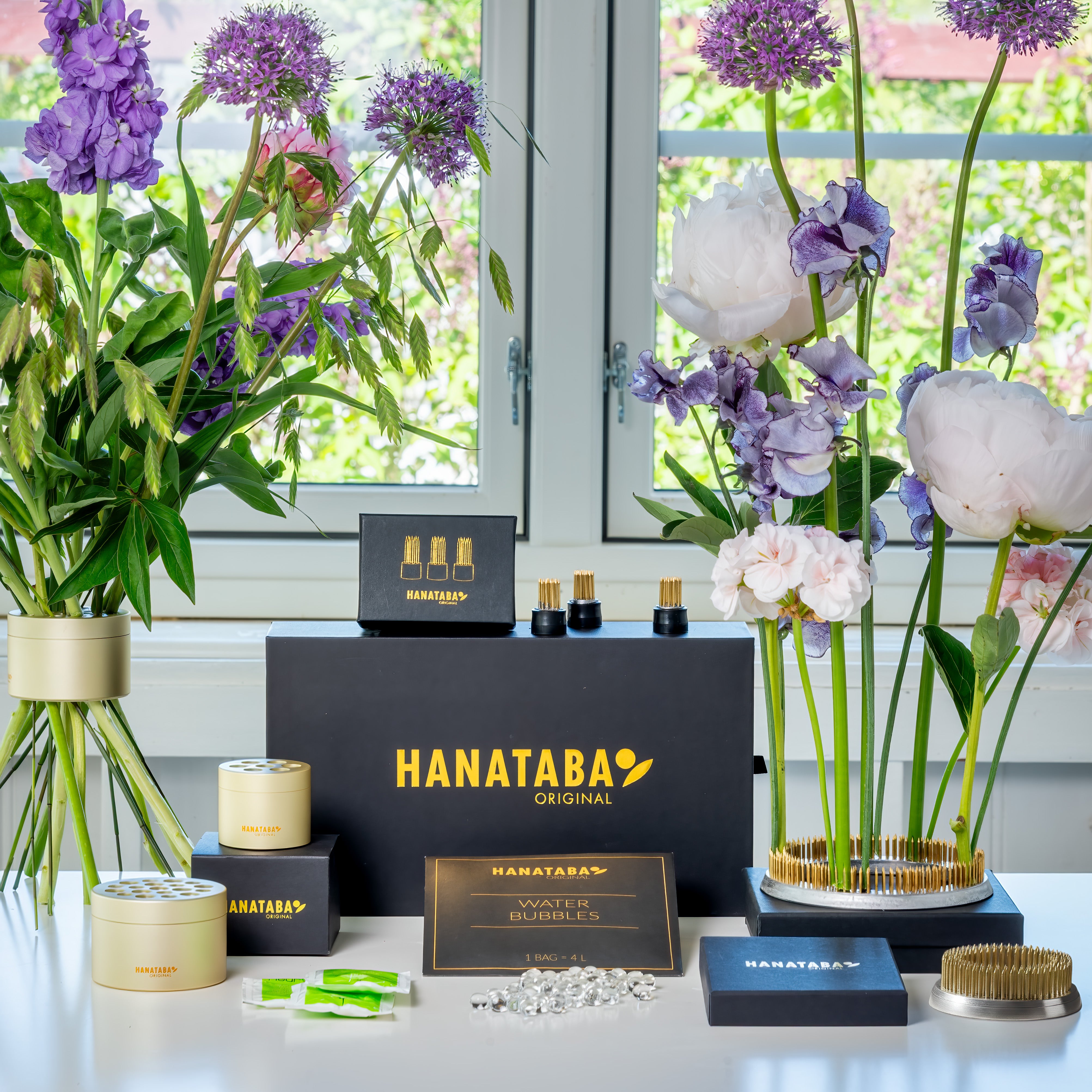 Hanataba flower arrangements products with flowers on a table