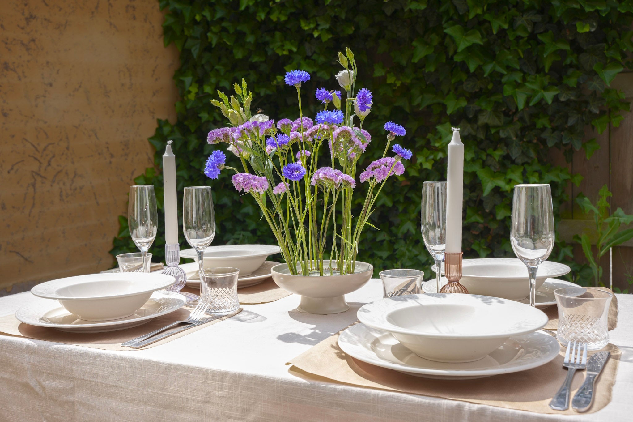 Close-up of Kenzan (Flower Frogs) showcasing their pin-like structure, designed to securely anchor floral stems. Outdoor table setting with purple flowers centerpiece – Hanataba garden flowers for summer dining