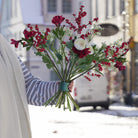 Hanataba bouquet with Red alstroemeria, white ranunculus, red hypericum berries and mixed greenery in a Hanataba bouquet twister Ivy Green