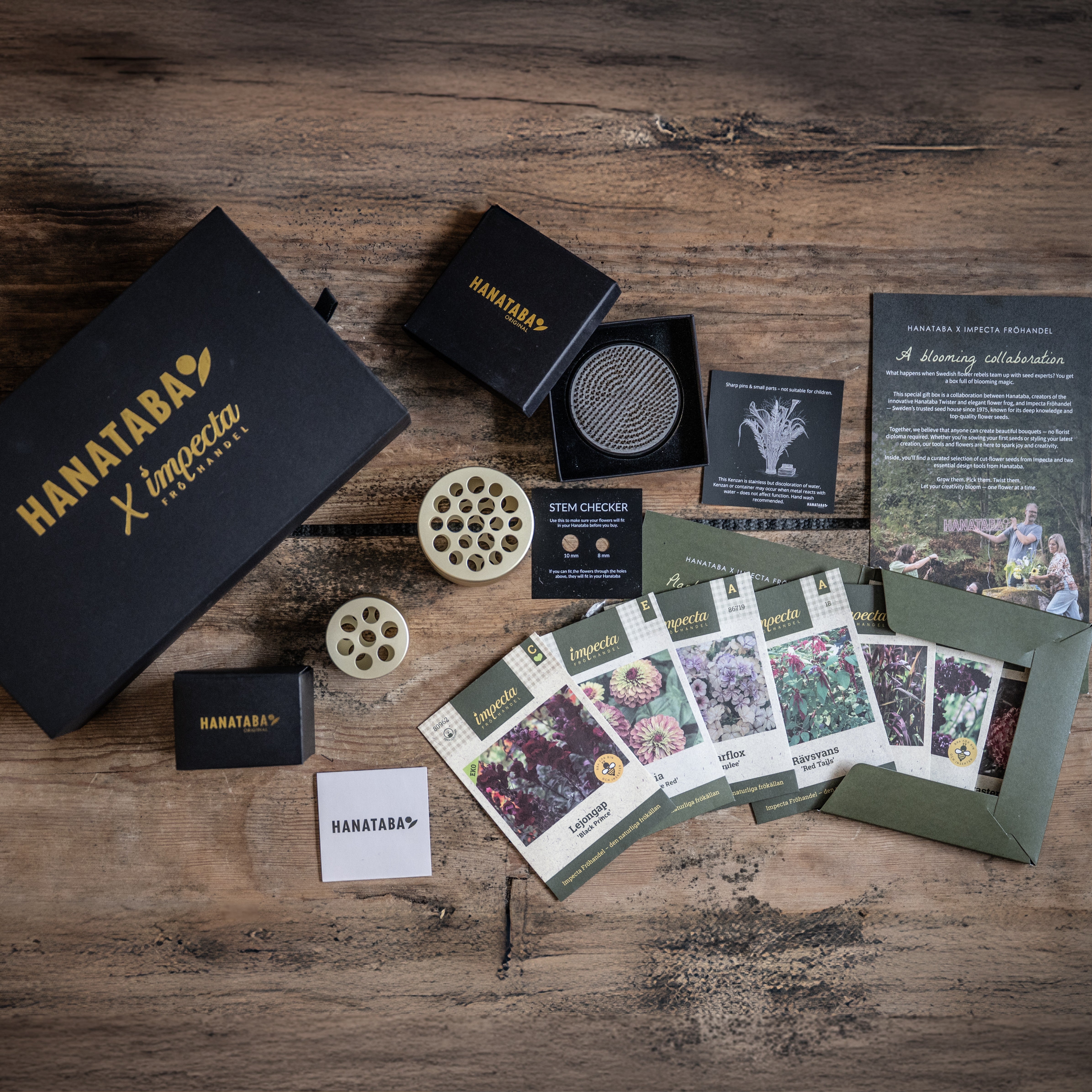 Collection of Hanataba products and impecta fröhandel seeds for the Impecta x Hanataba collaboration gift box on a wooden surface