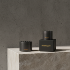 Two sizes of Hanataba bouquet flower twisters in color 'Pitch black' standing on a concrete block