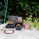 Collection of gardening tools and accessories on a table with a natural background by Hanataba Original