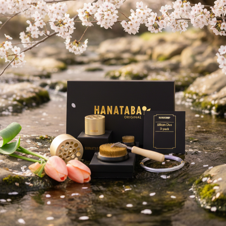 Hanataba floral arrangement tools with cherry blossoms and water in the background