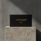 Black box with 'HANATABA' logo on a stone surface