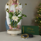 Artistic floral arrangement created with Hanataba Kenzan 120 mm placed in a marble bowl, combining modern Scandinavian design with traditional ikebana technique.