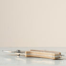 Hanataba garden shear with wooden handle on a marble surface