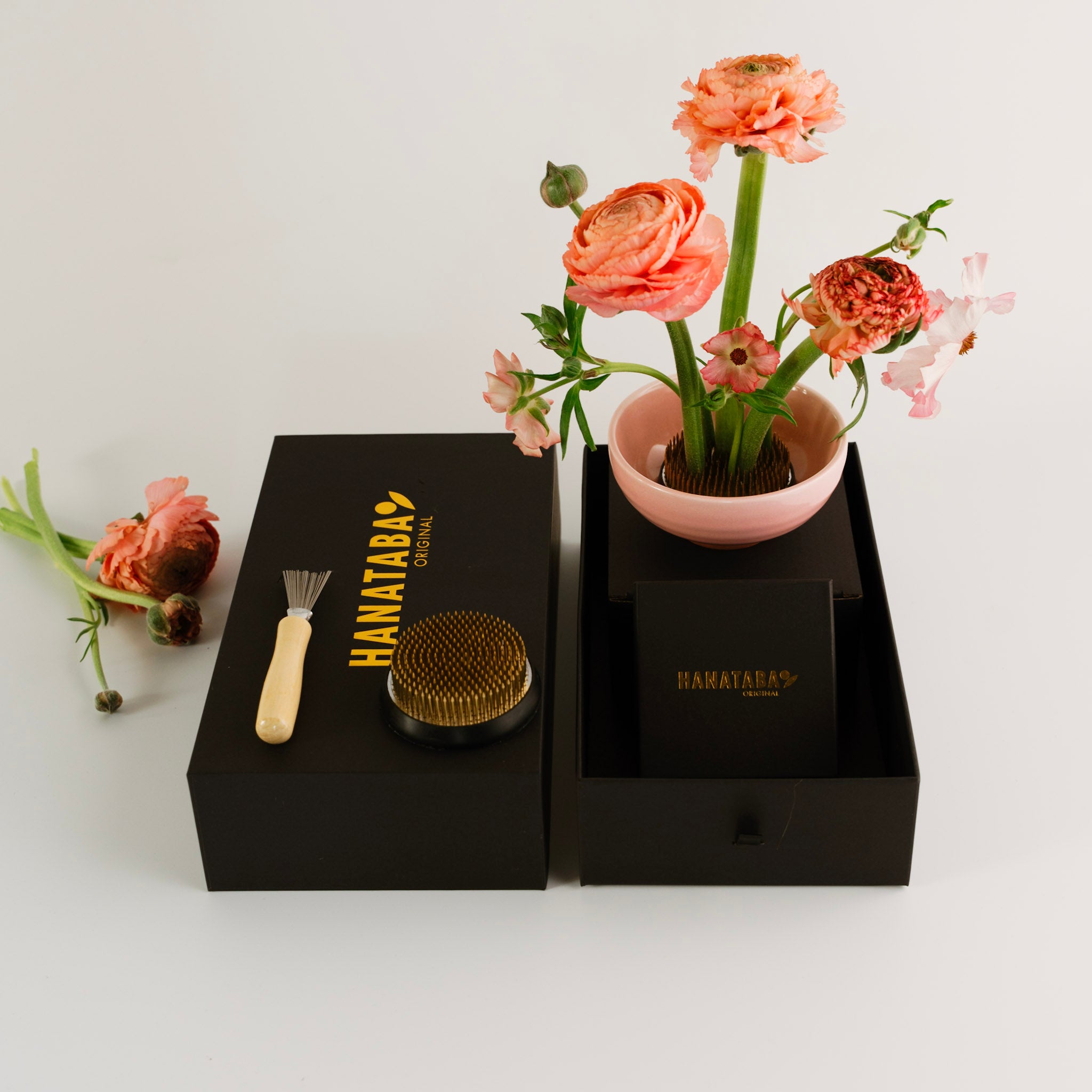 Hanataba grooming tools with a potted plant on a white background