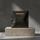 A sophisticated package labeled 'HANATABA Original Water Bubbles' with the text '1 BAG = 4L', accompanied by transparent water bubbles in front, designed for enhancing flower arrangements.