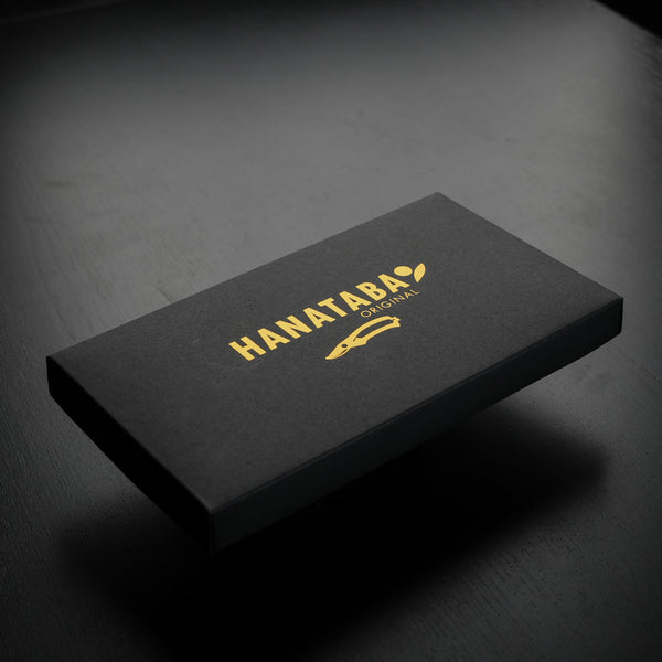 Elegant black box with 'HANATABA ORIGINAL' in gold lettering, showcasing brand packaging of secateurs