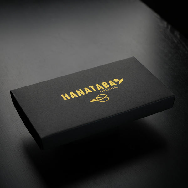 A sleek black packaging box with 'HANATABA ORIGINAL' in gold lettering and the brand's logo on top.