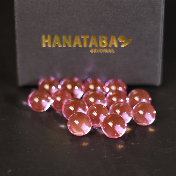 Close-up of translucent water bubbles pink by Hanataba, used to create stunning floral arrangements